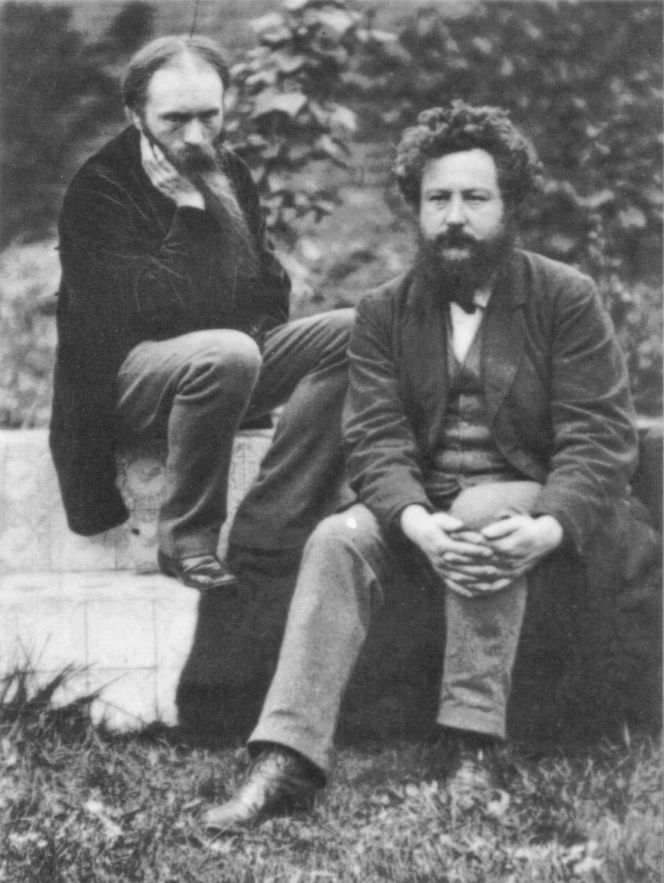 The design of Pomona and Flora was made by Edward Burne-Jones already in 1884. Burne-Jones (left) here portrayed together with William Morris, by the photographer Frederick Hollyer in 1874 (Wikimedia Commons).