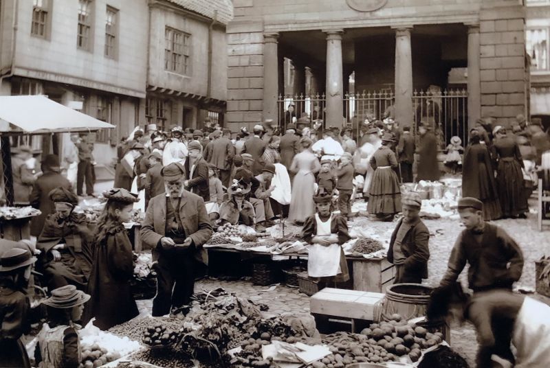 Photographs are another source of information about goods for sale on market days, but it is hard to distinguish any textiles for sale in the few photographs taken c.1880-1914 in Whitby Market Place. The majority of the products in the pictures seem to be food of all kinds, baskets, household wares and china. This particular picture was taken in the 1880s. (Courtesy of: Whitby Museum, Photographic Collection. Photo: Frank Meadow Sutcliffe).