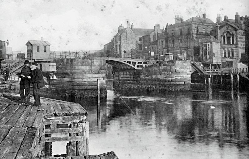 ‘The Bridge’, with several of Bridge Street’s drapery shops visible to the right, circa 1900, who regularly advertised during this period, among them James N. Clarkson & Son, described below. (Courtesy: Whitby Museum, Photographic Collection, Mammoth Postcard, B 295). 